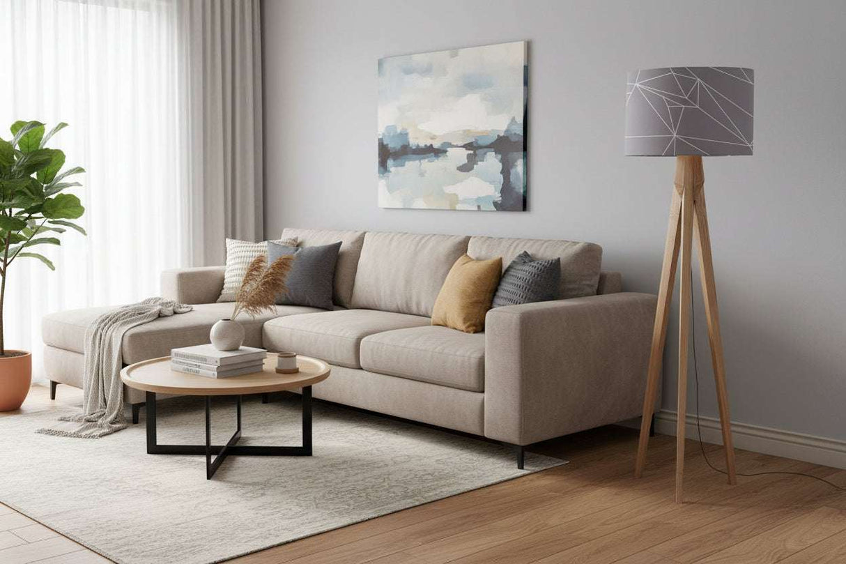 Stylish lampshade on a wooden tripod lamp in a modern living room setting