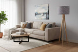 Stylish lampshade on a wooden tripod lamp in a modern living room setting