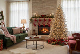 Stylish living room with a decorated Christmas Tree and festive holiday decor around a cosy fireplace