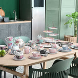 Elegant Afternoon Tea Set displayed on a table featuring floral teapots, cups, and tiered stands