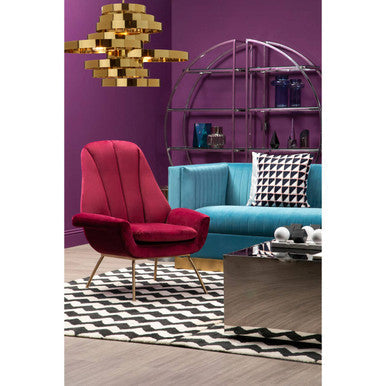 Orsina Lounge Chair in vibrant burgundy, styled with modern furnishings and decor