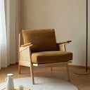 Nisu Home Lounge Chair in ochre fabric with wooden armrests and a modern design for stylish living spaces