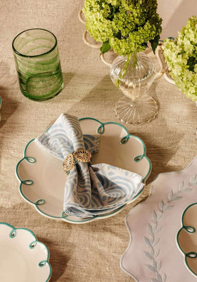 Casa by Josephine Jenno lunch plate with elegant scalloped design, styled with a decorative napkin