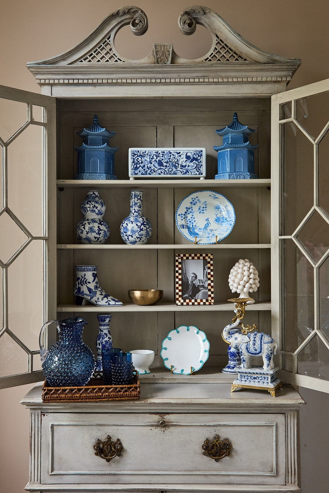 Casa by Josephine Jenno Lunch Plate displayed on a shelf with decorative blue and white ceramics
