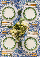 Casa by Josephine Jenno Lunch Plate in green design set on a floral tablecloth with cutlery and flowers