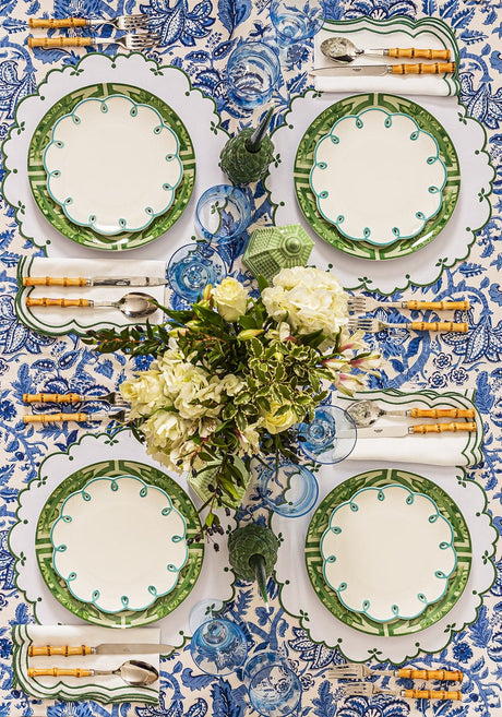 Casa by Josephine Jenno Lunch Plate in green design set on a floral tablecloth with cutlery and flowers