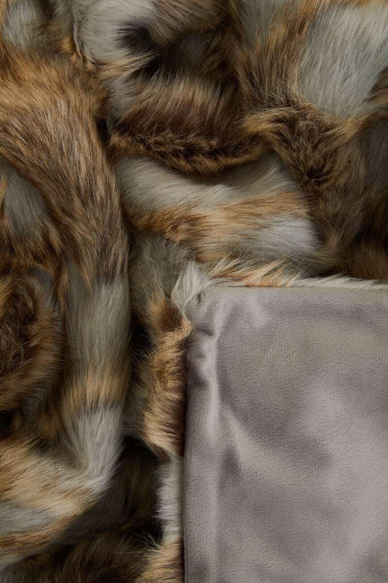 Orsina Fur Throw with a Luxurious Soft Texture and Rich Warm Tones for Comfort