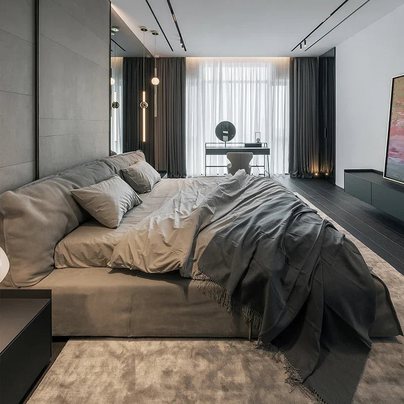 Modern bedroom featuring a Luxury Bed with elegant grey bedding and minimalist decor