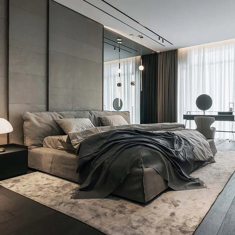 Elegant luxury bed in a modern bedroom with stylish grey decor and natural light