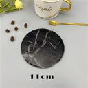 Black round placemat with marble design, 11cm diameter, ideal for enhancing dinnerware aesthetics