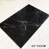 Elegant black marble placemat from Kitchen Essentials, perfect for enhancing dinnerware presentations