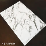 Elegant white marble placemats from Kitchen Essentials for enhancing dinnerware settings