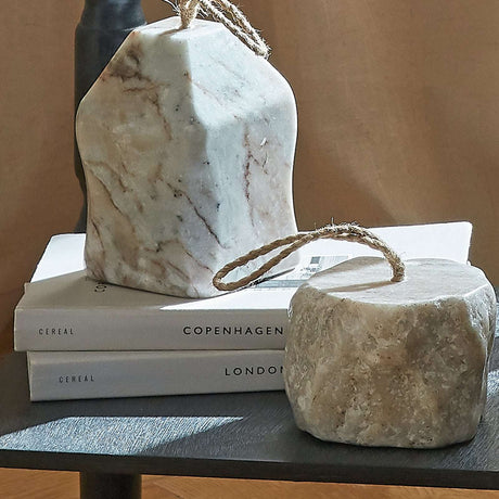 Elegant marble doorstop with a rustic rope handle, perfect for stylish home decor