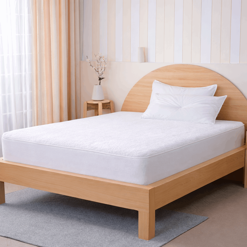 SHEET STORY Mattress Protector on a wooden bed for ultimate sleep protection and comfort