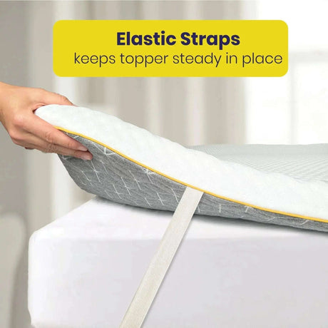 Brightr Sleep mattress topper with elastic straps keeping it steady in place on a bed
