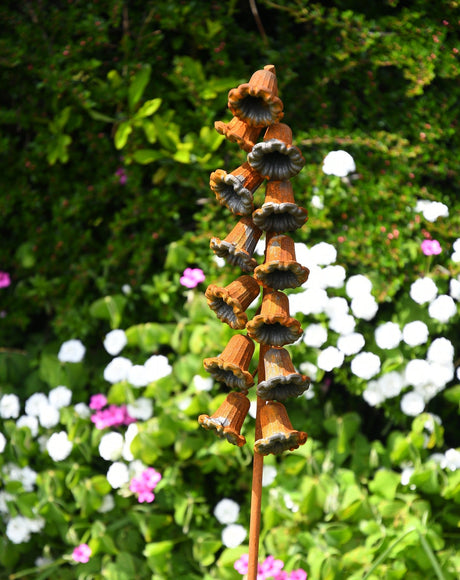 Ornamental Metal Flower Garden Stake with Multiple Bell-Shaped Flowers in a Colourful Garden