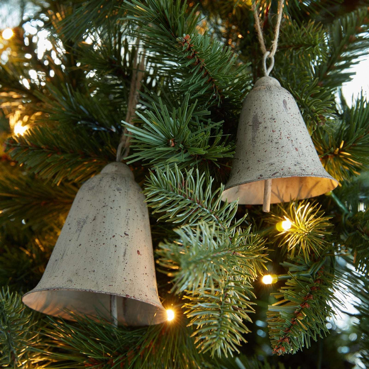 Metal Hanging Bell Christmas ornaments in rustic style, perfect for festive tree decorations