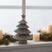 Metal Layered Tree Christmas decoration on a windowsill with candles and greenery