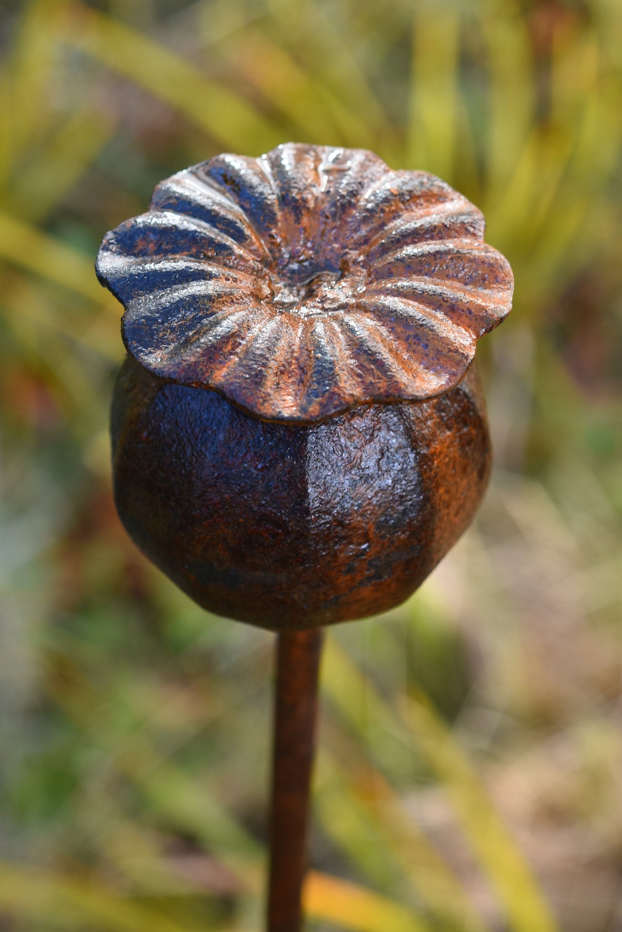 Handcrafted Metal Poppy Seedhead Garden Ornament with Detailed Petals and Rustic Finish