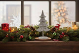 Metal Standing Tree Decoration on a Festive Mantle with Pinecones and Colourful Lights