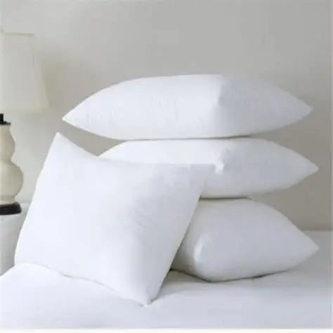 Four stacked white Microfibre Pillows on a bed with soft texture for a comfortable sleep