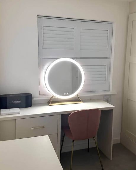 Hollywood mirror with warm LED lighting on a stylish desk in a modern setting