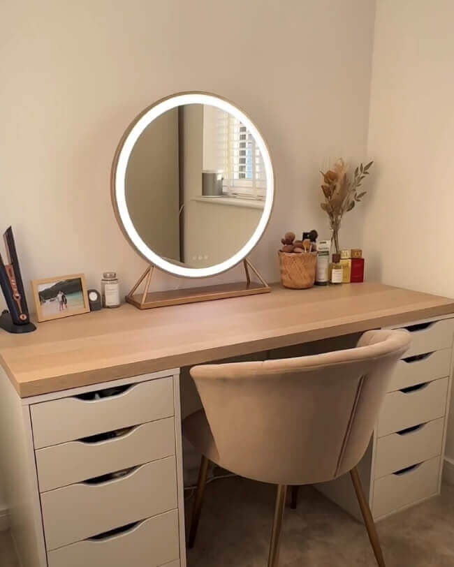 Stylish Hollywood mirror with warm lighting on a modern wooden desk for makeup or grooming