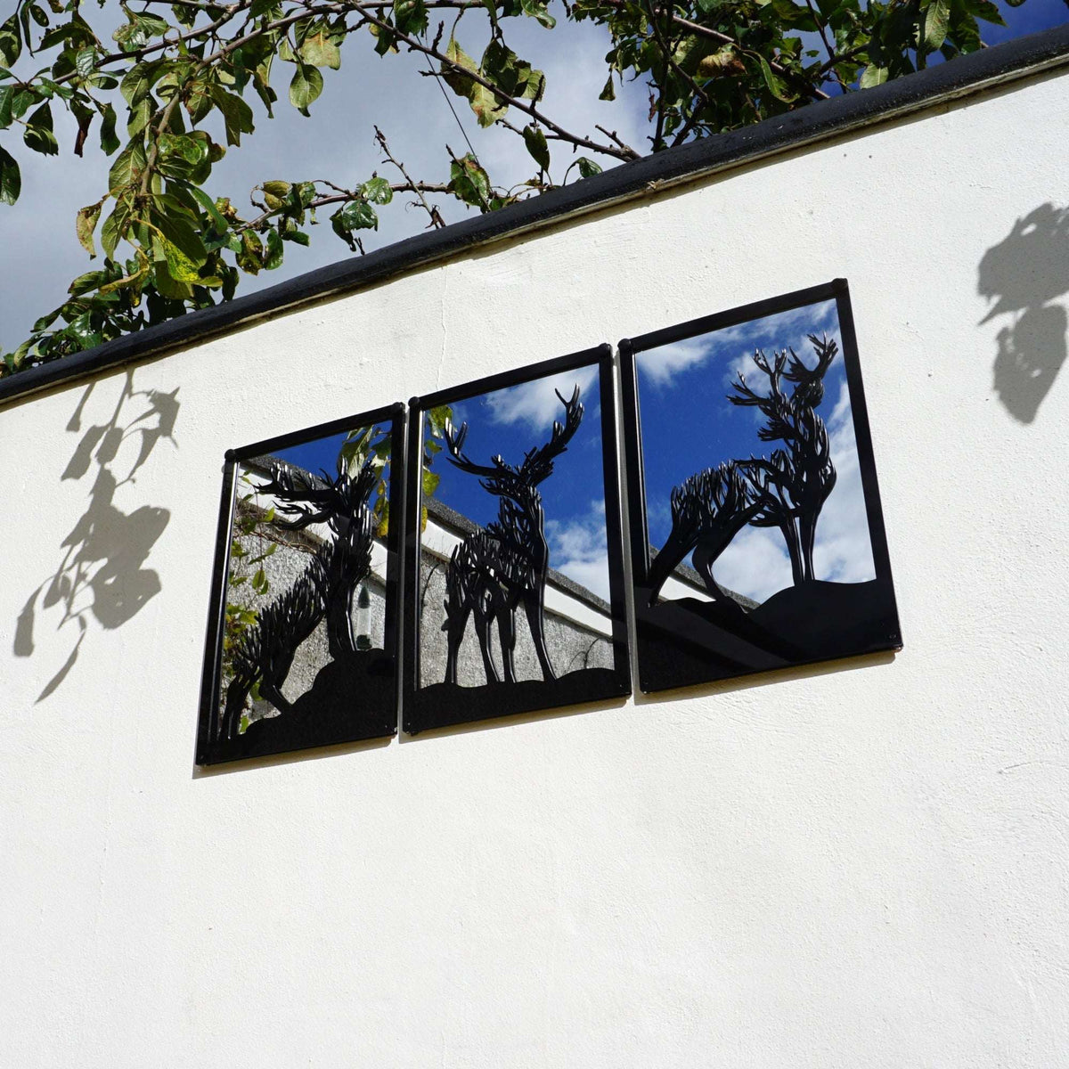 SunCatcher-UK Garden Mirror Panel featuring three deer silhouettes against a stylish backdrop