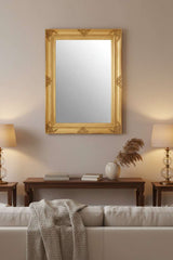 Orsina elegant gold-framed Wall Mirror above a sofa, enhancing living room decor