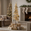 Elegant Christmas Tree with Warm White Lights and Festive Gifts in a Cozy Living Room Setting