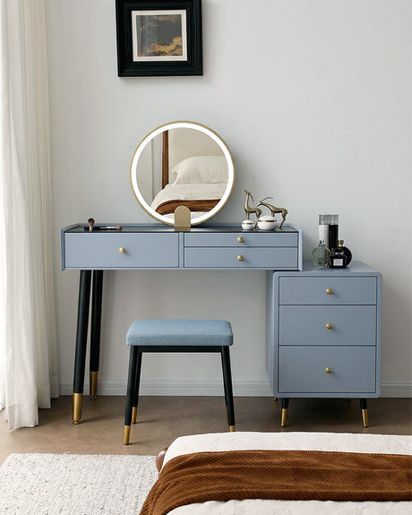 Le Di Vita stylish dressing table with circular mirror, drawers, and matching stool in a modern interior