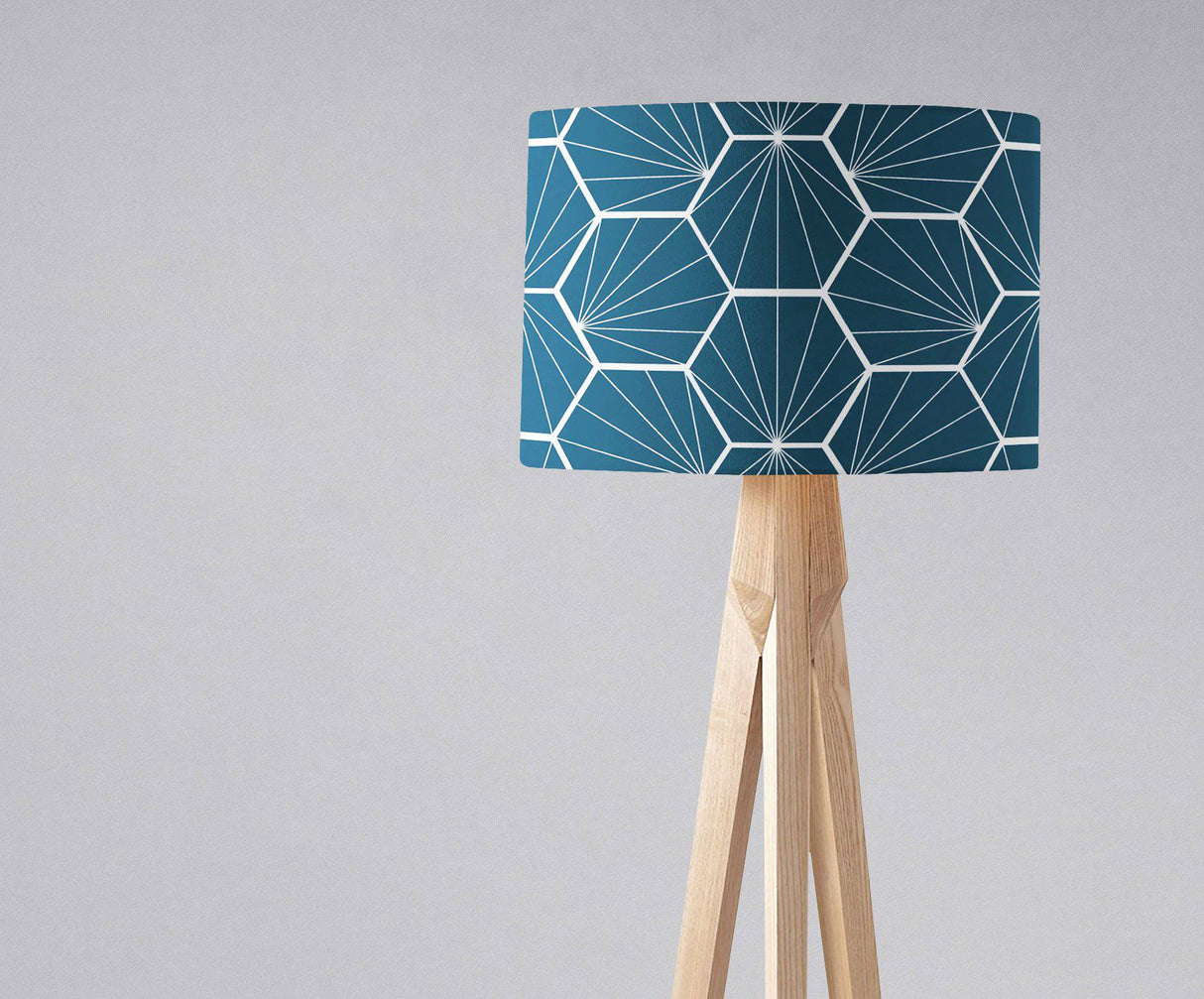 Geometric patterned lampshade in teal on a modern tripod lamp base from Shadow Bright