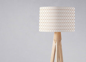 Shadow Bright Lampshade with geometric pattern on a wooden tripod lamp base