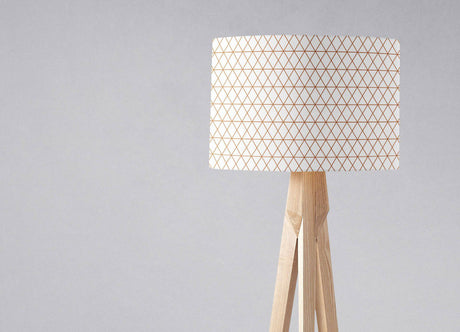 Shadow Bright Lampshade with geometric pattern on a wooden tripod lamp base