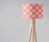 Shadow Bright stylish lampshade featuring a geometric pattern in coral tones on a wooden lamp base