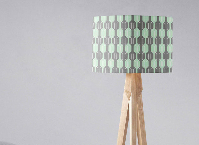 Geometric pattern lampshade by Shadow Bright on a wooden tripod lamp for stylish lighting