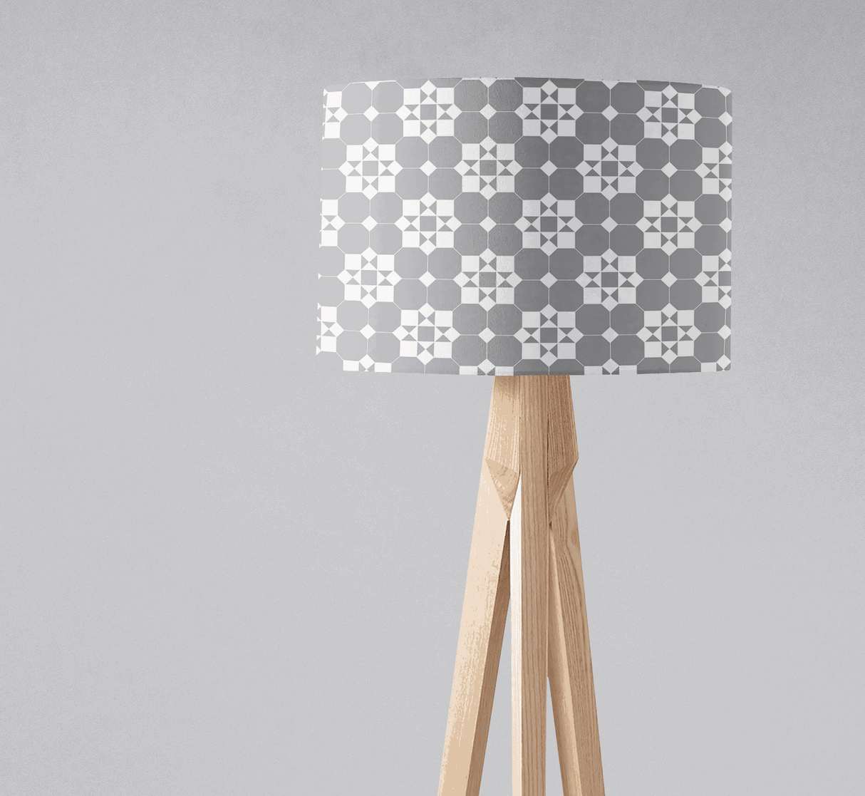 Stylish Shadow Bright lampshade with geometric grey pattern on a wooden tripod lamp