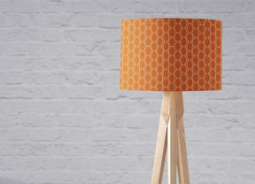 Shadow Bright Orange Patterned Lampshade on a Wooden Tripod Lamp for Modern Interiors