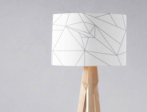 Stylish Shadow Bright lampshade featuring a geometric design in white and grey on a wooden lamp base