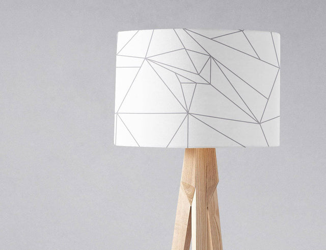 Stylish Shadow Bright lampshade featuring a geometric design in white and grey on a wooden lamp base