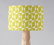 Bright yellow lampshade with geometric pattern designed by Shadow Bright