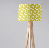 Bright yellow geometric lampshade by Shadow Bright on a stylish wooden tripod lamp stand