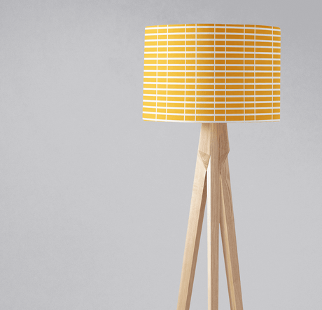 Bright yellow patterned lampshade from Shadow Bright on a wooden tripod base