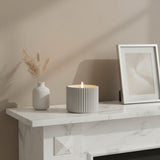 Elegant LED Candle by Shades 4 Seasons displayed on a marble shelf with stylish decor