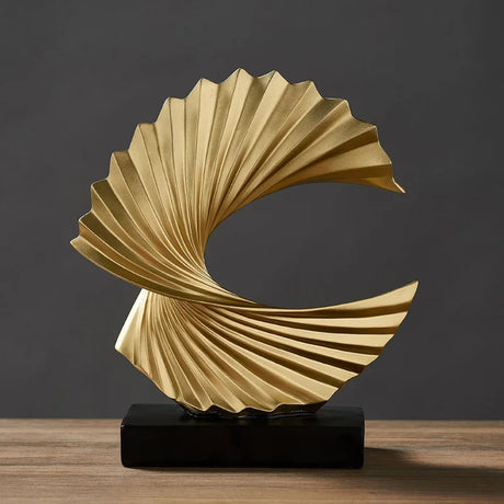 Stylish gold ornament in a swirling design, perfect for modern home decor