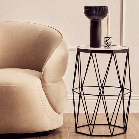 Modern Orsina Side Table in Black with Geometric Base, featuring a stylish lamp and candle on top