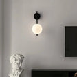 Modern Light My House Wall Lamp with a spherical white shade and sleek black base for stylish interiors