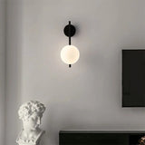 Modern Light My House Wall Lamp with a spherical white shade and sleek black base for stylish interiors