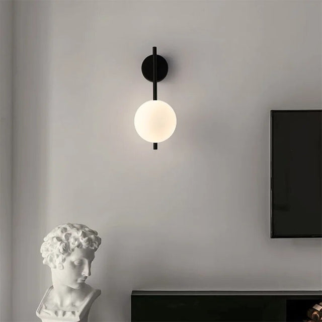 Modern Light My House Wall Lamp with a spherical white shade and sleek black base for stylish interiors