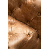 Close-up of Orsina Modular Sofa in distressed leather with button tufting and a warm brown finish
